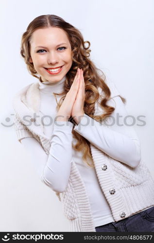 Young pretty woman with long hair wearing warm pullover