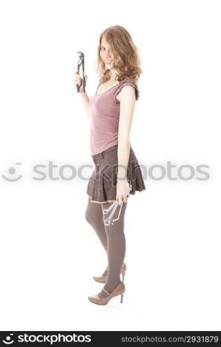 young pretty woman with ring spanners and pipe wrench against white background