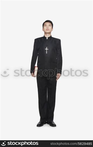 Young Priest Looking at Sky