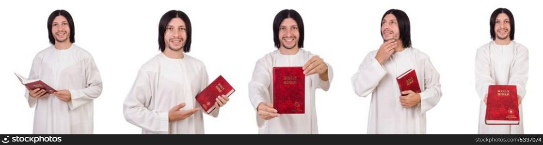 Young priest with bible isolated on white
