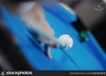 young pro billiard player finding best solution and right angle at billard or snooker pool sport game
