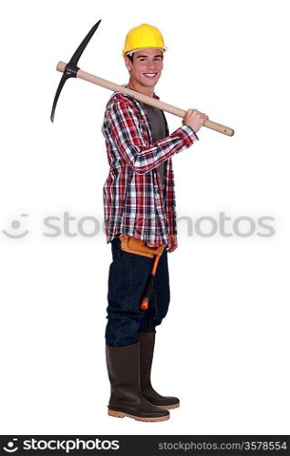 Young quarry worker with pick axe