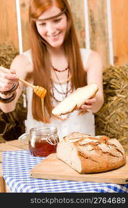 Young red-hair hippie woman have organic breakfast in country style