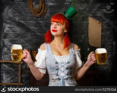 young red-haired Irish waitress in a little leprechaun hat brings two glasses of foamy beer in a St. Patrick?s Day pub. Irish waitress beer