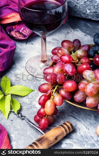 Young red wine. Glass with red wine from autumn grape variety