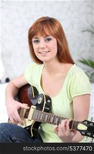 Young redhead with guitar