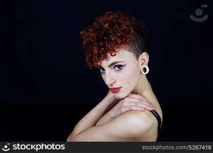 Young redhead woman with a different style