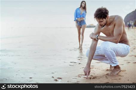Young, relaxed couple on the tropical beach