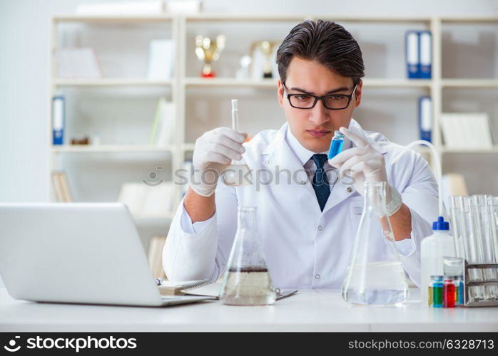 Young researcher scientist doing a water test contamination expe. Young researcher scientist doing a water test contamination experiment in the laboratory