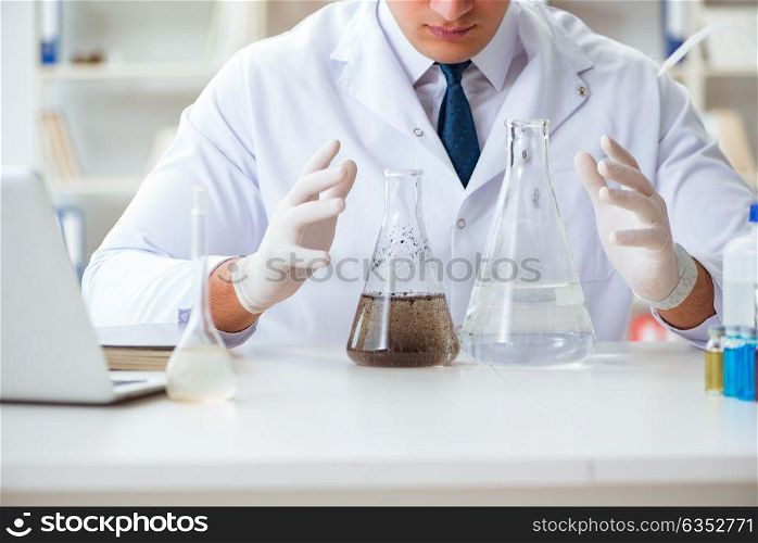 Young researcher scientist doing a water test contamination expe. Young researcher scientist doing a water test contamination experiment in the laboratory