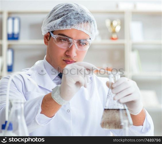 Young researcher scientist doing a water test contamination experiment in the laboratory. Young researcher scientist doing a water test contamination expe