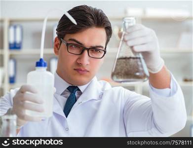 Young researcher scientist doing a water test contamination experiment in the laboratory. Young researcher scientist doing a water test contamination expe