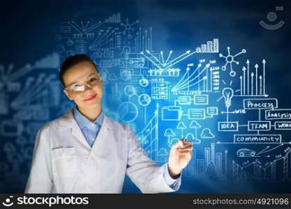 Young researcher. Young woman researcher in medical uniform drawing chemistry formulas