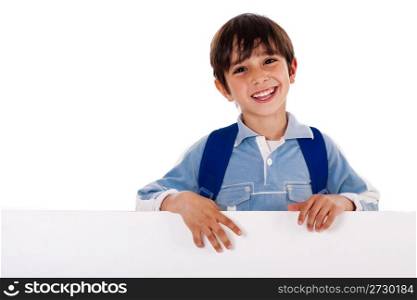 Young school kid standing behind the blank board isolated on white background