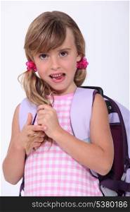 Young schoolgirl with a rucksack