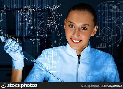 Young scientist in laboratory in white uniform