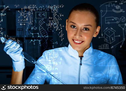 Young scientist in laboratory in white uniform