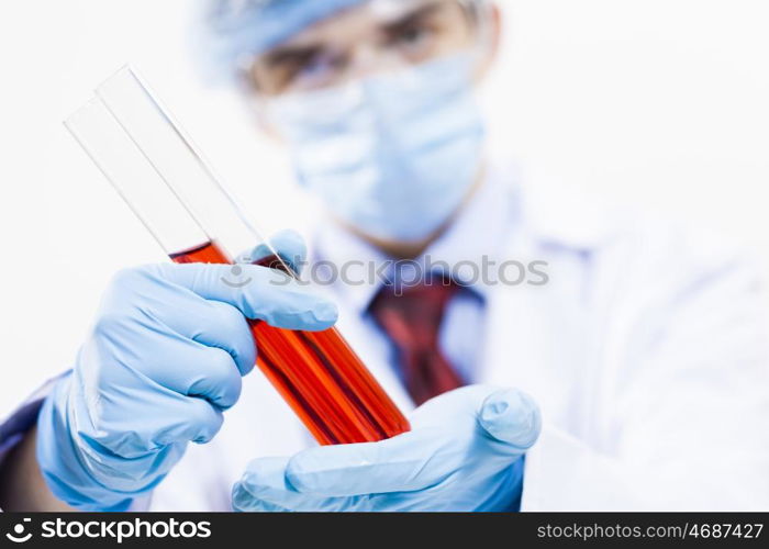 Young scientist making chemical tests in laboratory. In the name of science