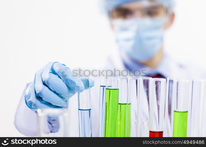 Young scientist making chemical tests in laboratory. In the name of science