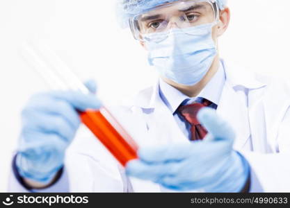 Young scientist making chemical tests in laboratory. In the name of science