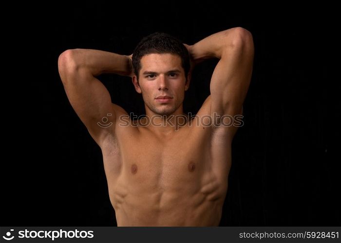 young sensual man on a black backgroung