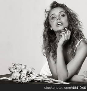 Young sensual model girl. Toning. Flowers. Black and white.