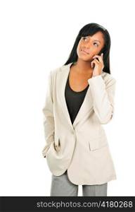 Young serious black businesswoman on cell phone looking up