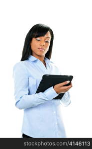 Young serious black woman working with tablet computer