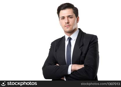 Young serious businessman in tie and black suit poses, isolated on white background