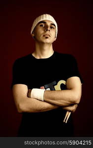 young serious man portrait with hat, studio picture