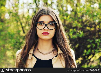 Young sexy woman closeup portrait. Stylish hipster girl posing on the street with interested look. Vintage lifestyle trendy portrait.