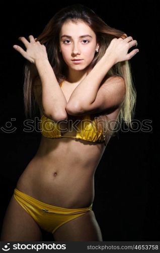 Young sexy woman in yellow bikini &#xA;