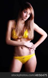 Young sexy woman in yellow bikini &#xA;