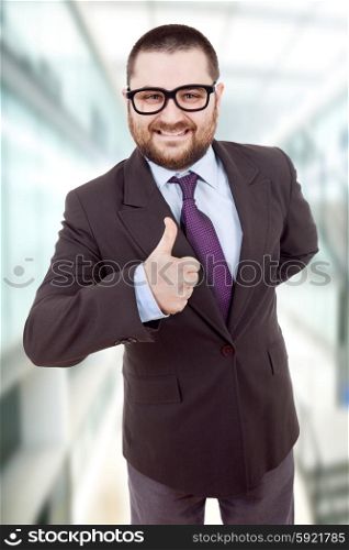 young silly business man going thumb up