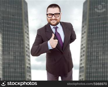 young silly business man going thumb up