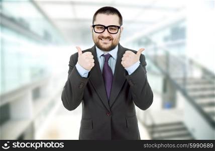 young silly business man going thumbs up
