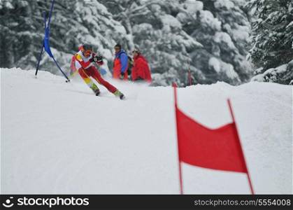 young skier race fast downhil at winter snow scene