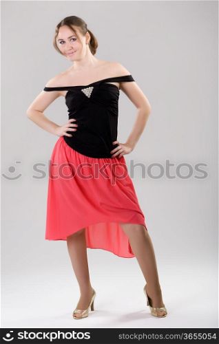 Young slender woman in a smart dress