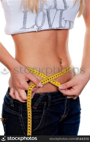 young, slender woman with tape measure their body: