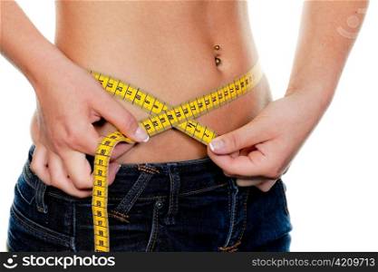 young, slender woman with tape measure their body: