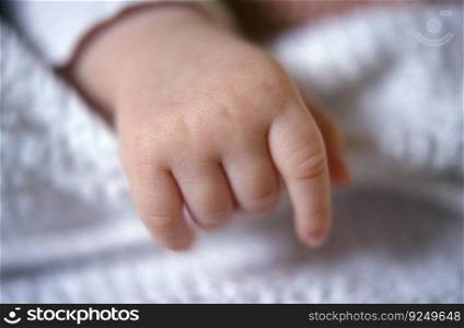 Young small baby hand and finger close up