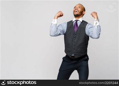 Young smart shouting african-american businessman doing success win gesture.. Young smart shouting african-american businessman doing success win gesture
