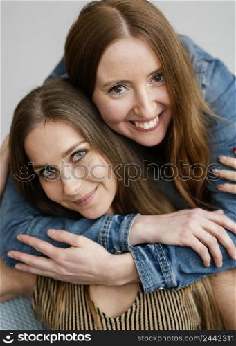 young smiley girlfriends hugging 3