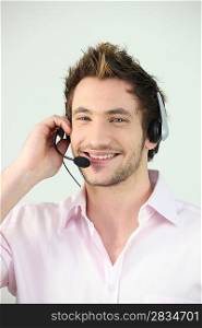 Young smiley man wearing a headset