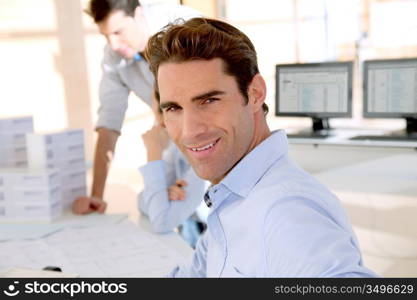 Young smiling and cheerful businessman