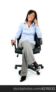 Young smiling black businesswoman on phone sitting in leather office chair