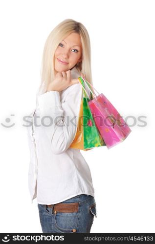 Young smiling blonde in a white shirt with shopping bags in their hands
