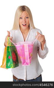 Young smiling blonde in a white shirt with shopping bags in their hands