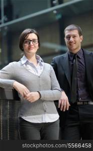 Young smiling business woman and business man portrait