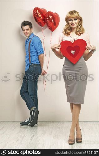 Young smiling couple with valentine&rsquo;s marks